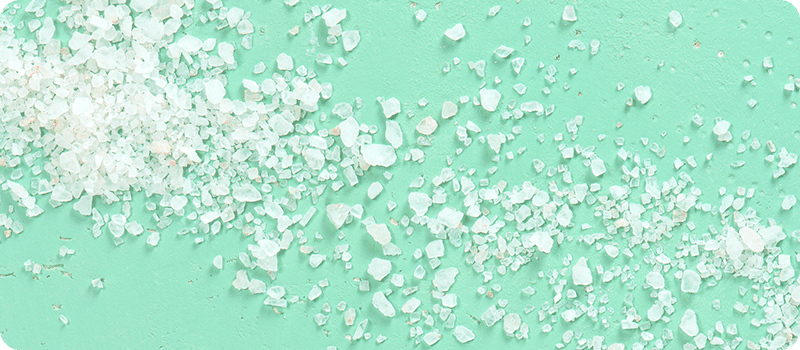 hashing vs salting large salt spread across mint colored background